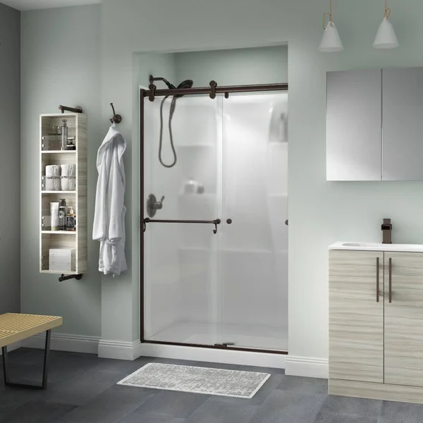 Delta Portman 48 x 71 in. Frameless Contemporary Sliding Shower Door in Bronze with Niebla Glass