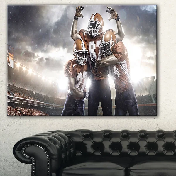 Designart 'American Football Players on Stadium' Sports Canvas Print 32 in. Wide x 16 in. High