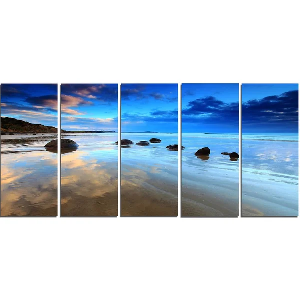 Design Art 'Cloudy Sky Over Moeraki Boulders' Photographic Print on Wrapped Canvas - Size: 20 inch H x 40 inch W x 1 inch D, Blue
